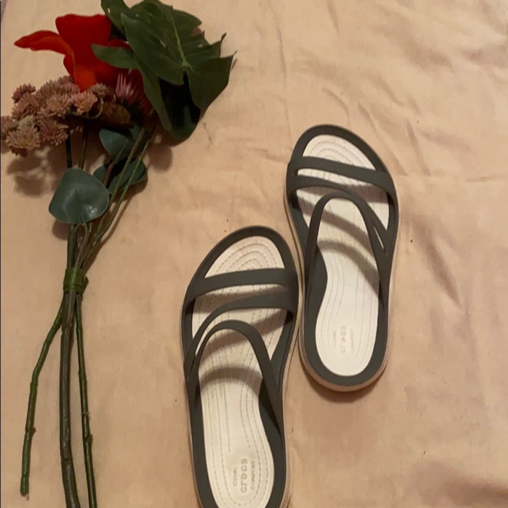Gray and white crocs sandals